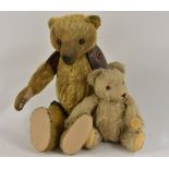 An early 20th century gold plush humpback Teddy Bear, unusual leather capped joints,