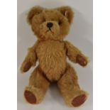 A Musical Teddy Bear, possibly Pixie Joy (Stourbridge) with suede pads and label to foot,