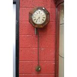 A Regency brass inlaid octagonal wall clock