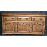 An 18th century design oak low dresser