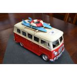 A reproduction tinplate red and white camper