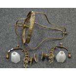 A pair of 19th century cast brass light sconces with opaque glass shades;
