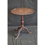A George III oak circular tripod table, c.
