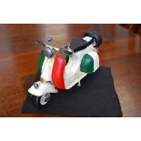 A reproduction tinplate Italian scooter