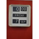 A retro day/date wall clock, by Solari, QC, Octine,