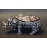 A cast metal double inkwell, as a rhinoceros,