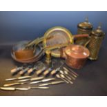 A graduating harlequin set of eight copper pans; copper kettle; Moorish storm lanterns,