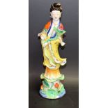 A Chinese export ware figure, deity on a lotus leaf, with moving hand, 30.