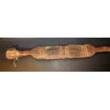 Tribal Art - a Tuareg tent peg, the broad central section shaped and carved in horizontal bands,