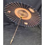 An early 20th century paper parasol, bamboo shaft, c.