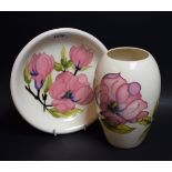 A Moorcroft Magnolia pattern dish, 21.