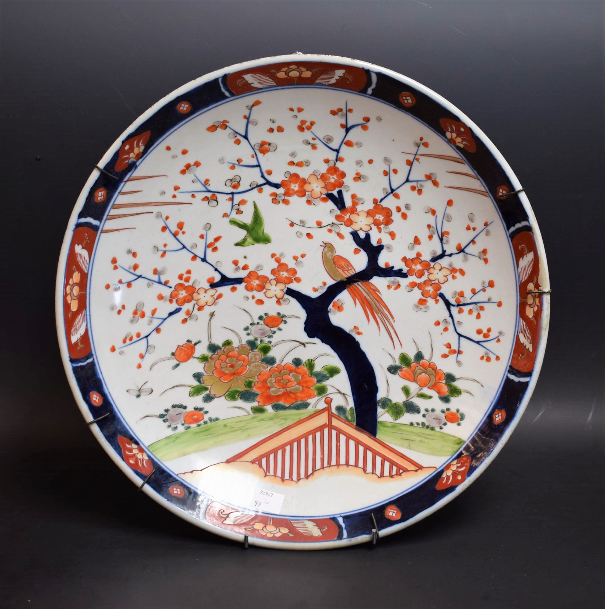 A 19th century style Japanese charger, decorated with a blossoming tree,