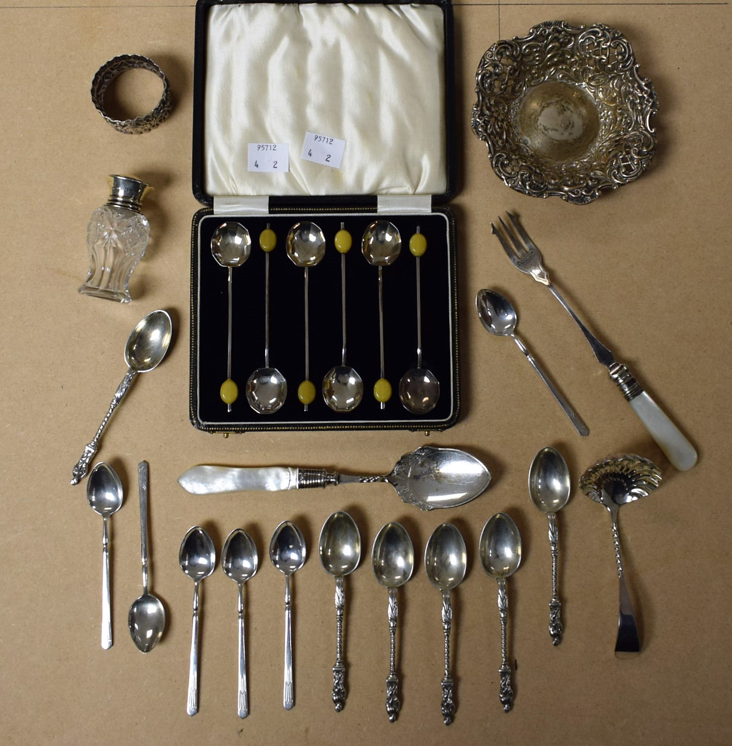 A set of six silver apostle teaspoons; a pierced silver bonbon dish;