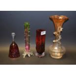 A late 19th century glass vase, a similar bud vase, a 1970's red glass vase,