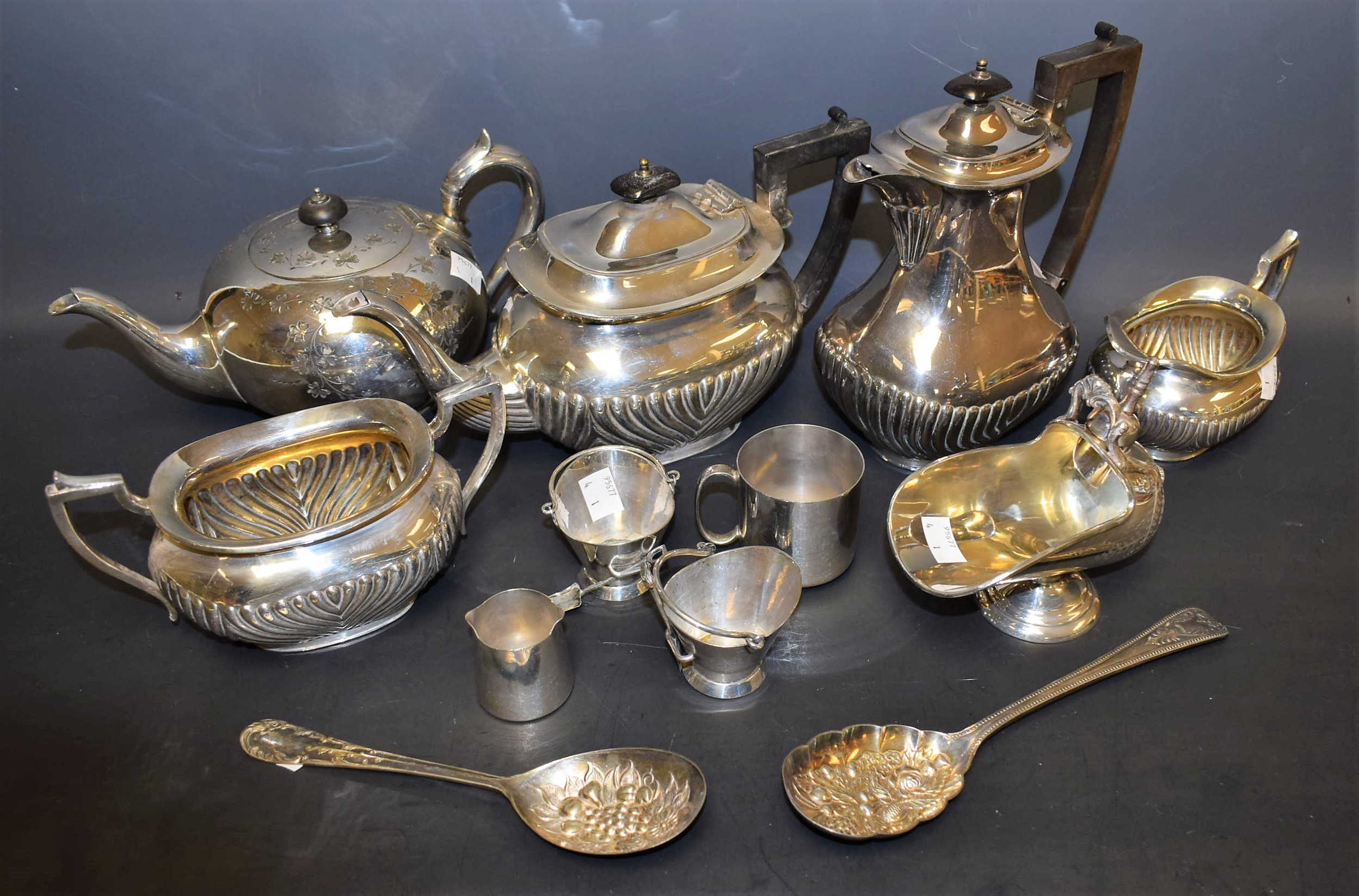 A silver plated boat shaped tea service, half fluted; a pair of EPNS scuttle shaped table salts,