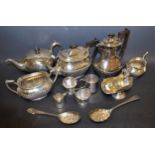 A silver plated boat shaped tea service, half fluted; a pair of EPNS scuttle shaped table salts,