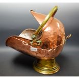 A 19th century copper helmet shaped coal scuttle,