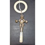 A child's silver rattle modelled as a bear with mother of pearl haft,