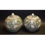 A pair of Chinese Famille Noir ginger jars,