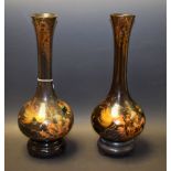 A pair of lacquered vases, decorated with exotic fish and coral,