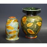 A Royal Doulton stoneware ovoid vase with everted rim decorated with autumnal leaves, 14.