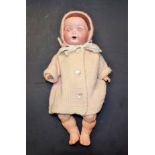 An Armand Marseille bisque head doll, sleeping brown eyes, open mouth, two upper teeth,