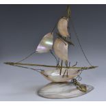 An early 20th century mother of pearl and gilt metal model, of a ship,