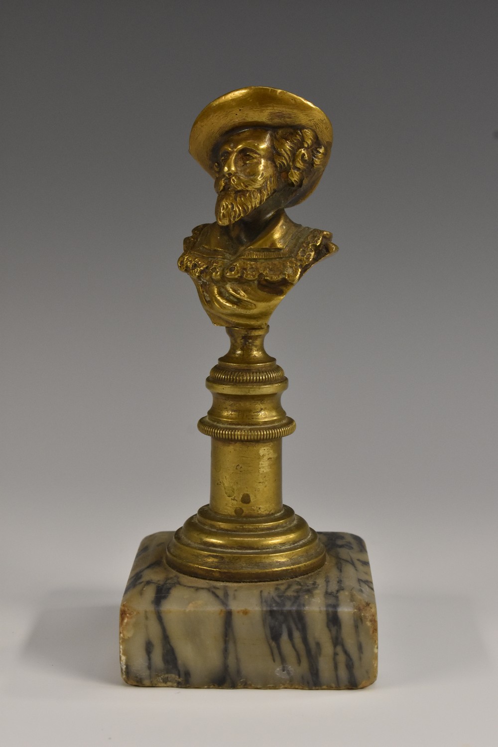 A 19th century bronze desk bust, of a bearded gentleman, square marble base, 13.