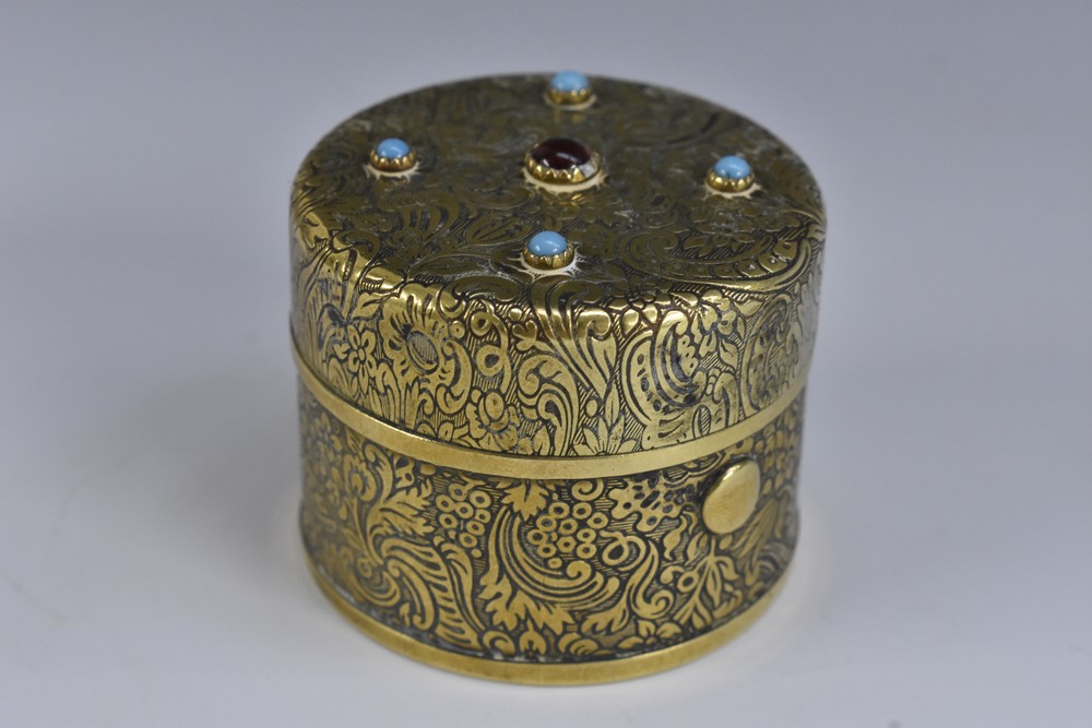 A 19th century brass travelling inkwell, hinged cover mounted with red and turquoise cabochons,