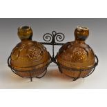 A pair of late 19th century amber glass fire extinguisher grenade,