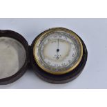 A 19th century lacquered brass travelling pocket barometer, 5cm silvered register inscribed Ross,