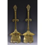 A pair of unusual 19th century brass armorial cream skimmers,