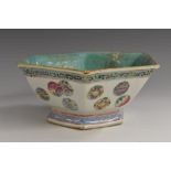 A Chinese hexagonal footed dish, brightly painted in polychrome enamels with floral roundels,