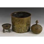 A Middle Eastern brass measure or jardiniere,