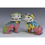 A pair of 19th century Continental Chinoiserie faience models, of Chinese Dogs of Fo, boldly glazed,