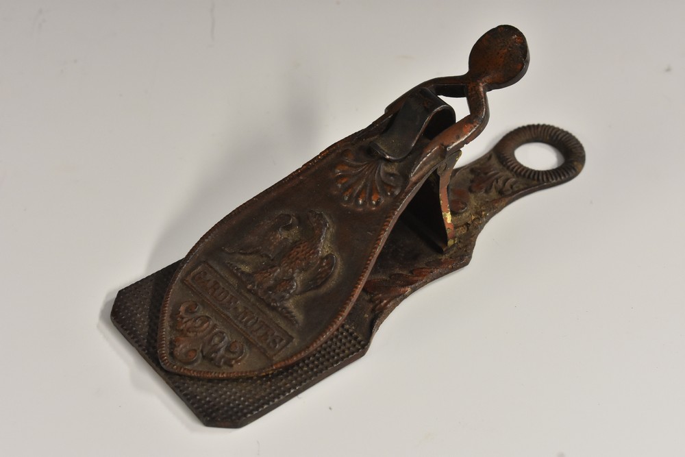 A 19th century French painted metal desk clip, in relief with and eagle and inscribed Garde-Notes,