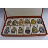 A collection of Chinese reverse decorated ovoid flattened ovoid snuff bottles,