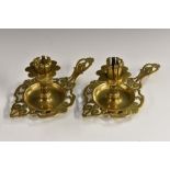 A pair of early 20th century Austrian brass patent chamber sticks,