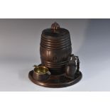 A Black Forest type tobacco jar, as a wine cask, hinged cover with push-button release mechanism,