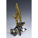 A 19th century lacquered brass monocular microscope, by AST & OS Co Ltd, Chancery Lane, London,