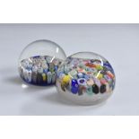 A pair of millefiori miniature paperweights, typically worked with coloured canes,
