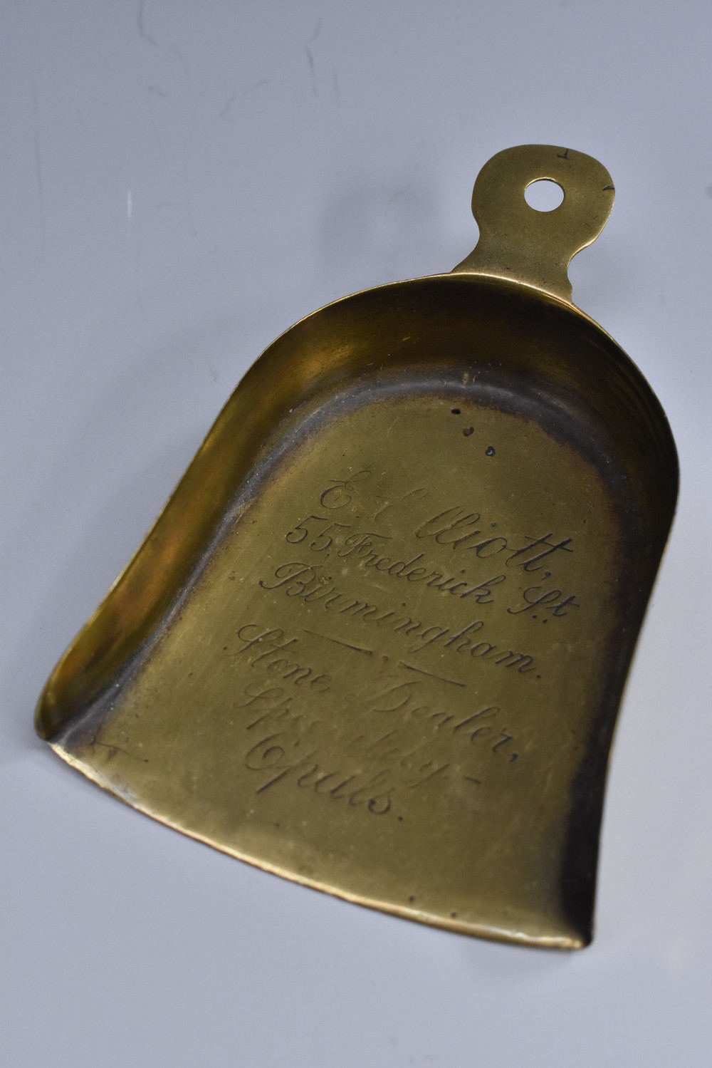 A 19th century brass jeweller's advertising diamond scoop, inscribed E Elliott, 55 Frederick St,