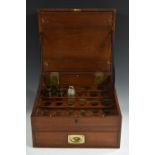 A mahogany physician's apothecary cabinet, hinged cover with brass plaque inscribed G A Davis,