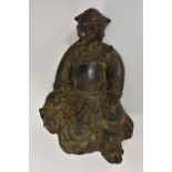 A Chinese painted and patinated bronze mount, cast as an Immortal,