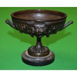 A 19th century French brown patinated bronze pedestal mantel urn,