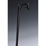 A 19th century ebony walking cane, shaped crook handle,