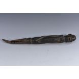 Tribal Art - an African figure or peg, carved as a stylized human form, iron spike to base,