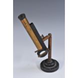 A 19th century lacquered brass and black painted microscope slide viewer, 11.