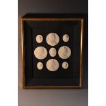 An arrangement of Grand Tour type plaster intaglios,