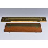 A 19th century brass draughtsman's barrel ruler, by J Davis & Son Derby, 46cm wide; another ruler,